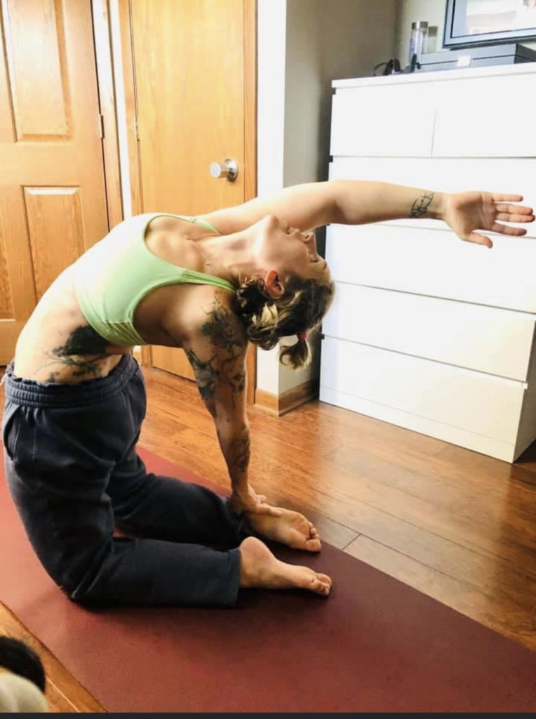VIBE Yoga, Health & Fitness Yoga Instructor Kate Yanke practices in her home.