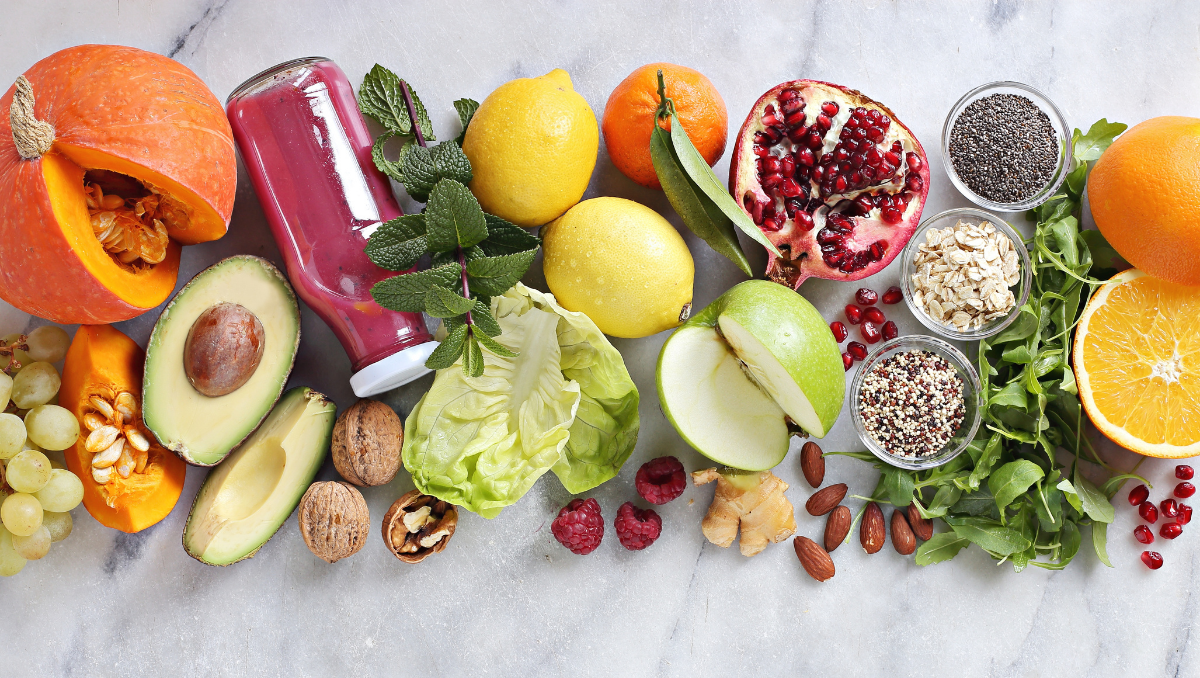 An array of fruits, vegetables, nuts, and grains. Plant-based foods provide various nutritional benefits, and in this post, VIBE discusses five of them.