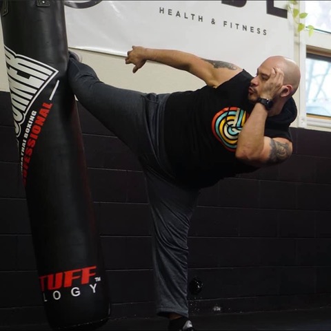 Grabiel teaches Thai/Pads Cardio Kickboxing at Vibe Yoga Health & Fitness, one of their yoga and fitness classes